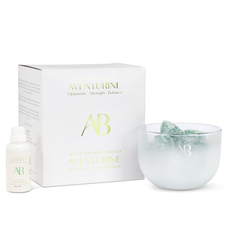 Aventurine product set with box, bottle, and bowl on a white background