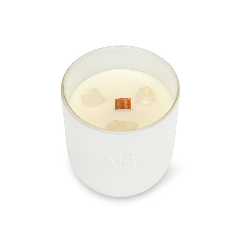 White candle with wooden wick on a white background