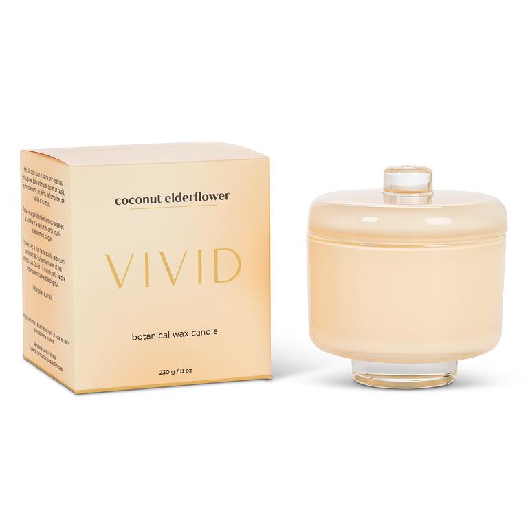 Vivid coconut elderflower candle and packaging on a white background