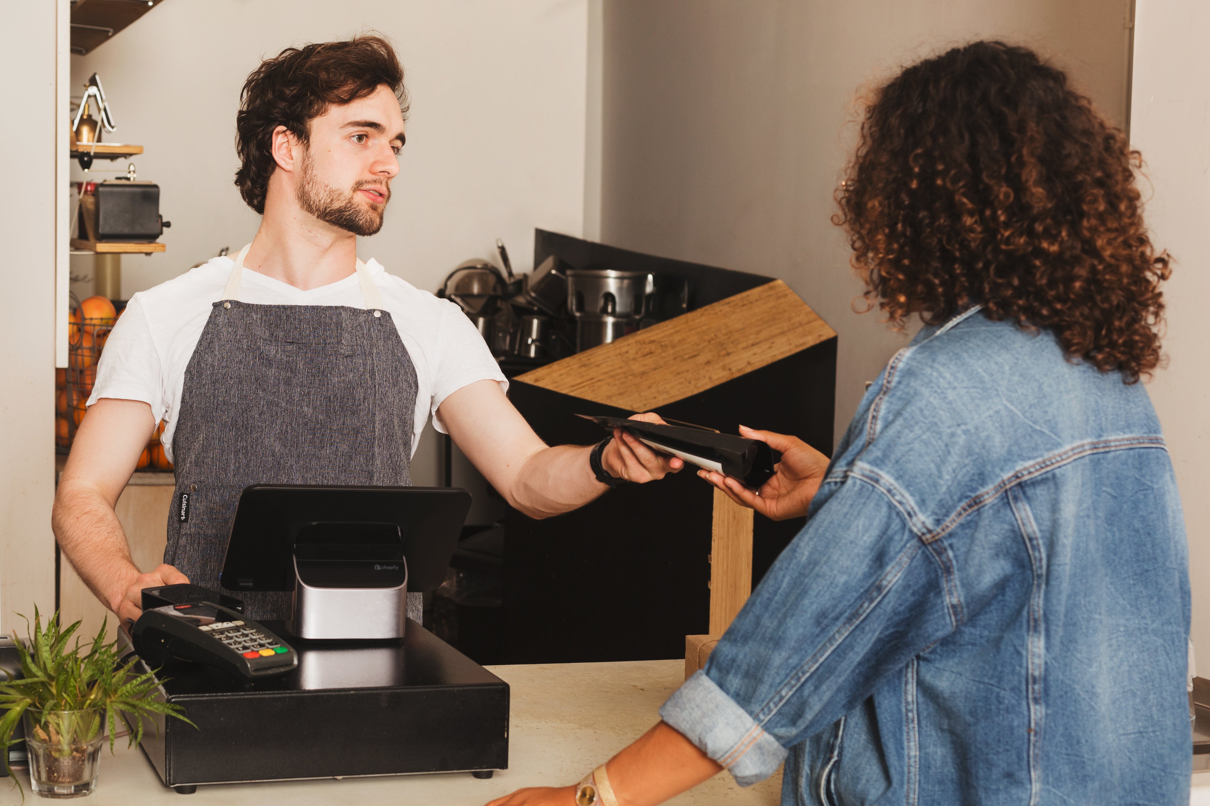 cashier interacting with a customer.