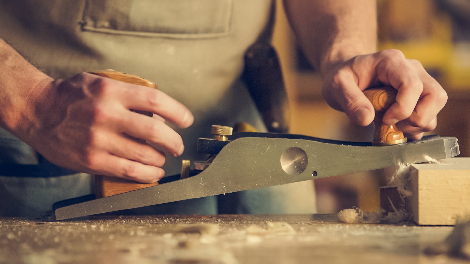 man crafting wood.