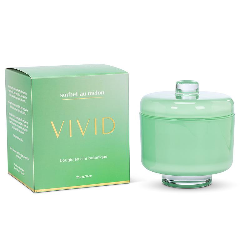 Green candle with lid and packaging labeled 'Vivid' on a white background
